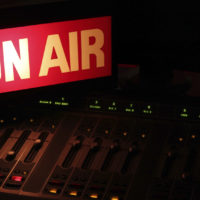 On Air sign in a studio broadcasting via radio, podcast or wireless transmission.